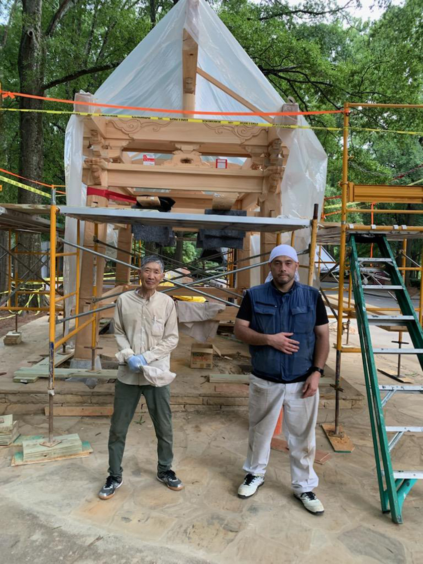 Hiroshima carpenters Noritaka Kondo and Daisuke Koyama work on the Peace Bell Tower