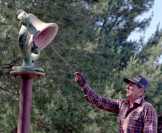 President Reagan rings a bell on his ranch in California.