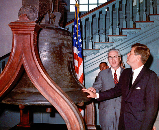 President Kennedy touches the Liberty Bell