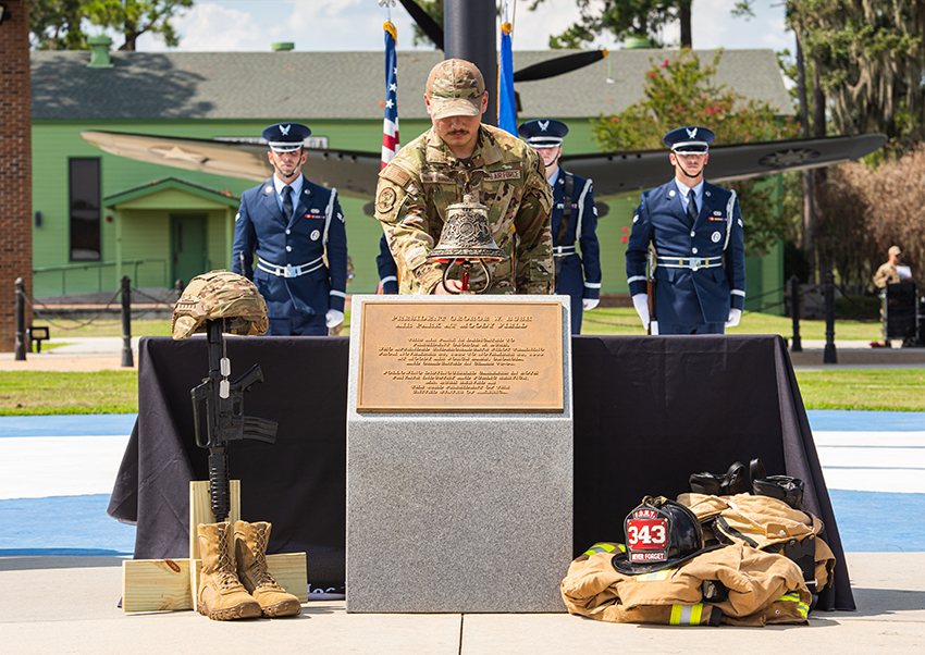 U.S. Air Force Airman Martinez Hernandez rings a memorial bell during a 9/11 memorial ceremony