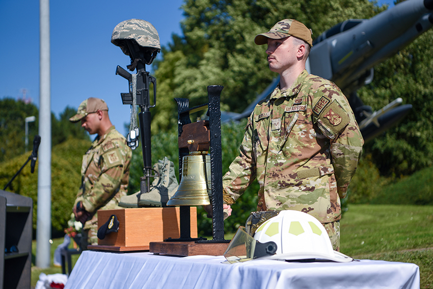 U.S. Air Force Senior Airman Jared Waddell rings a bell during a 9/11 Remembrance ceremony