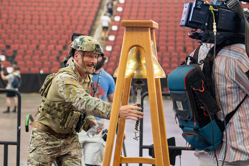 U.S. Air Force Chief Master Sgt. Brian Smith rings a bell after completing the 9/11 Tower Challenge