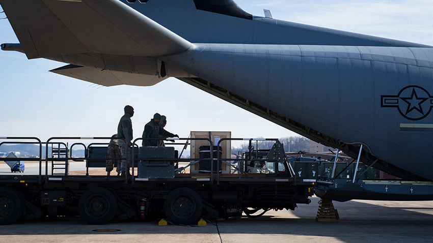 One of the bells of Balangiga is loaded onto a U.S. Air Force aircraft