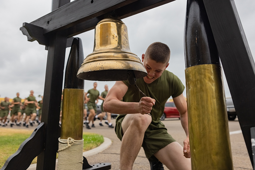 A new U.S. Marine with Echo Company rings the bell during a motivational run