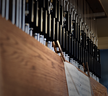 Compose new works of music to be debuted on carillon