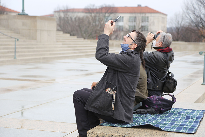 Festivalgoers listen to the bells on New Year's Day