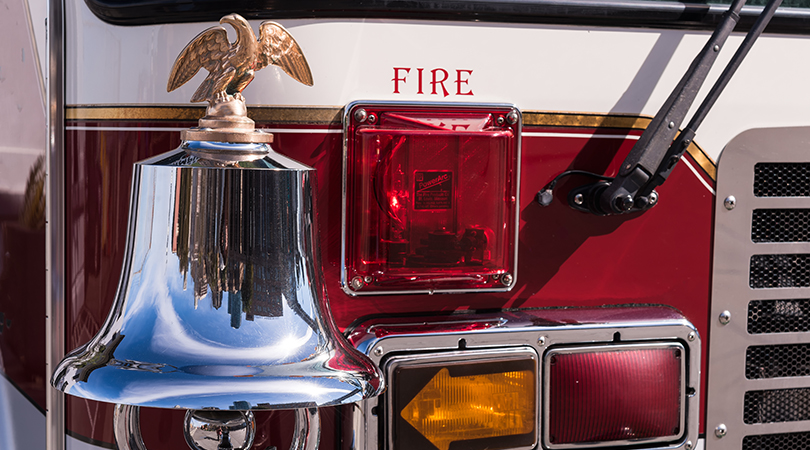 Fire bell mounted on the front of a fire truck