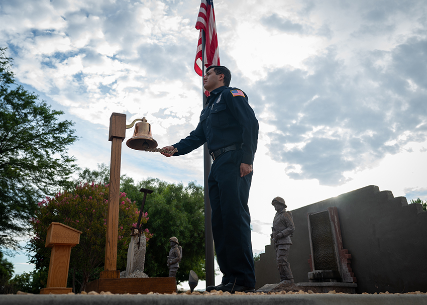 U.S. Air Force Firefighter Ruben Amaya rings the September 11th, 2001 Memorial Bell