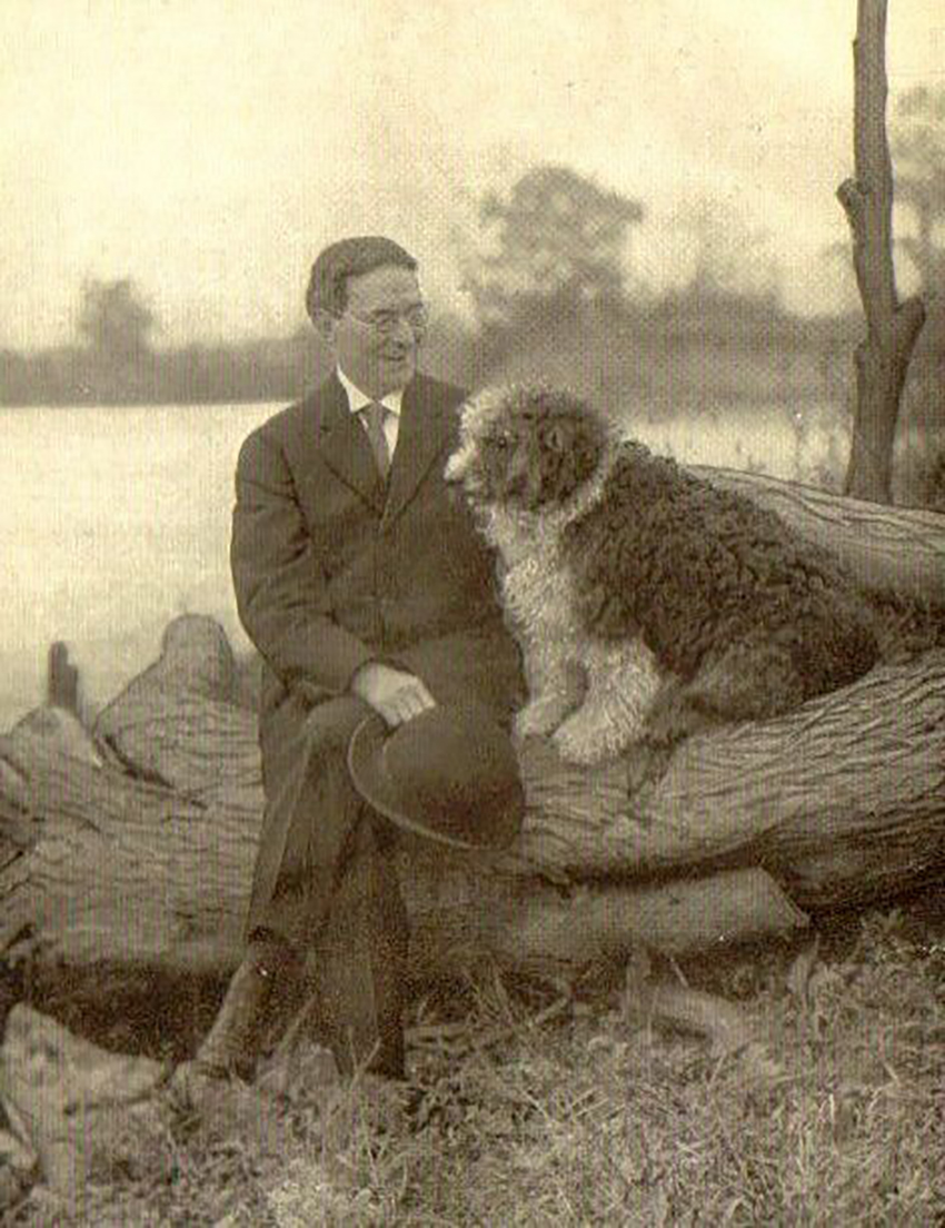 Photograph of Folger McKinsey, the Bentztown Bard, and his dog