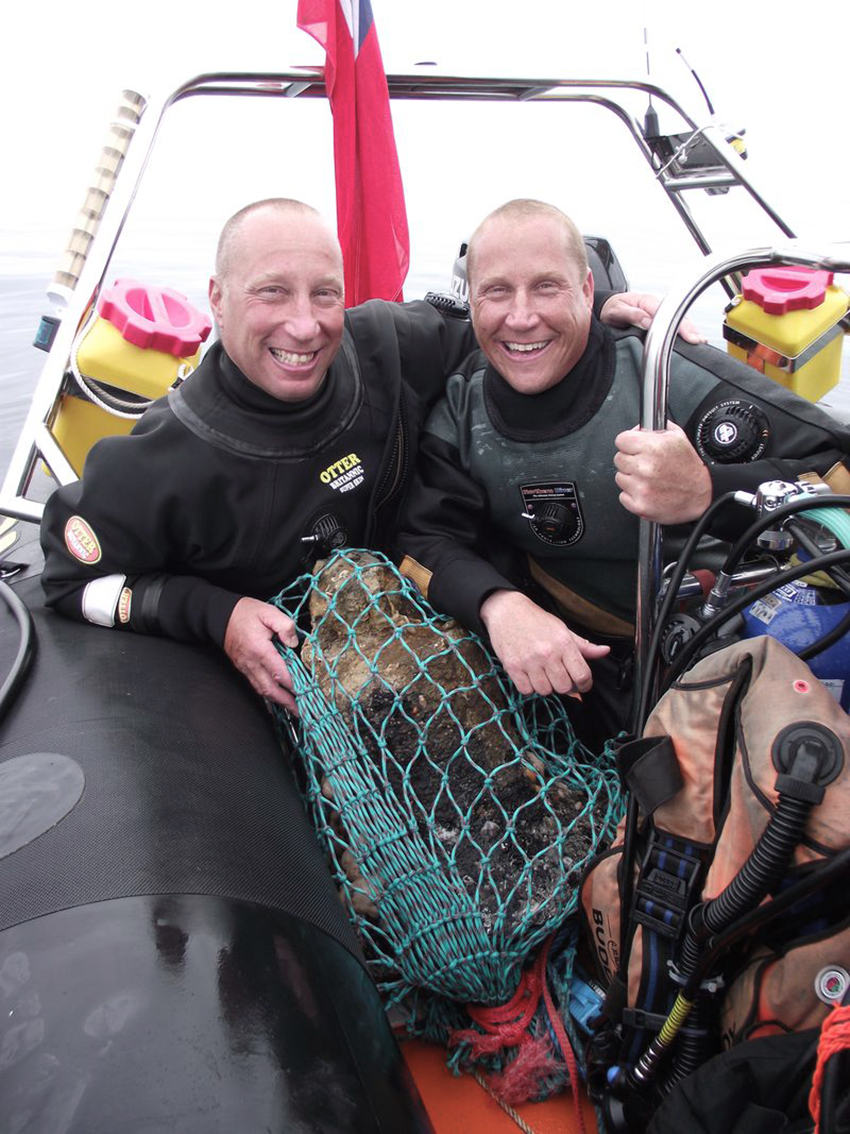 Brothers Lincoln Barnwell and Julian Barnwell with HMS Gloucester Ship's Bell