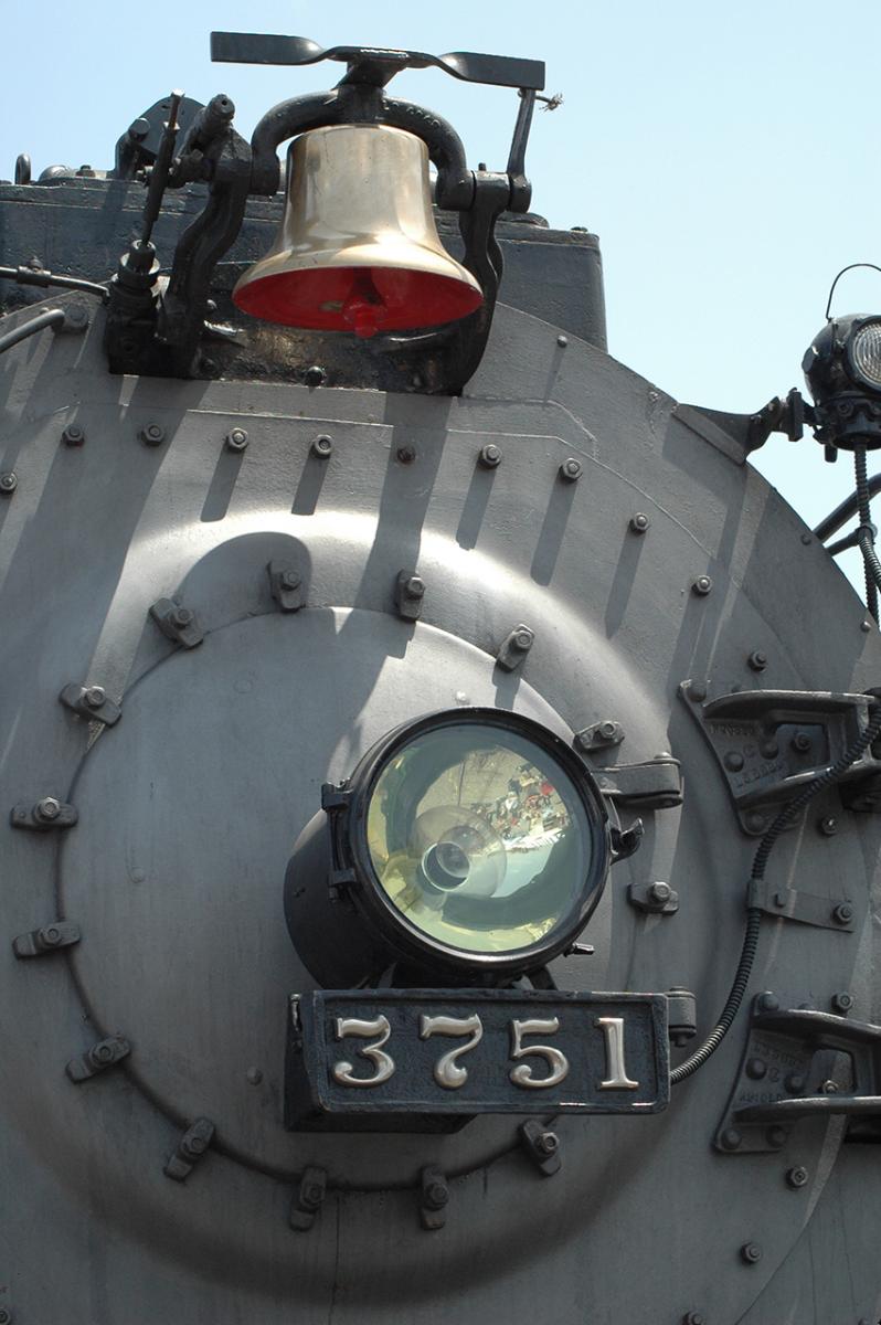 Locomotive bell mounted on front of train