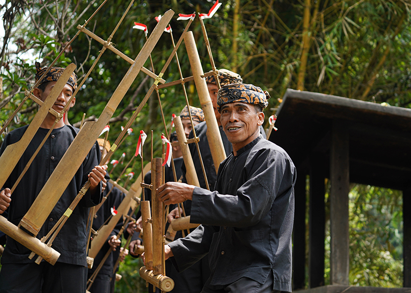 Men playing the idiophone angklung in Indonesia
