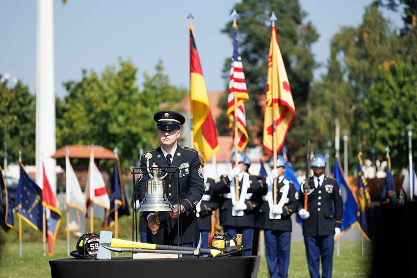 A U.S. Soldier performs the ringing of the bell in remembrance of Sept. 11