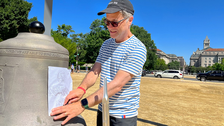 Paul Ramírez Jonas completes a graphite rubbing on a bell
