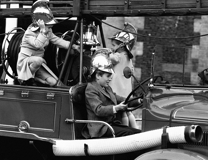 Prince William and Prince Harry ring a fire bell