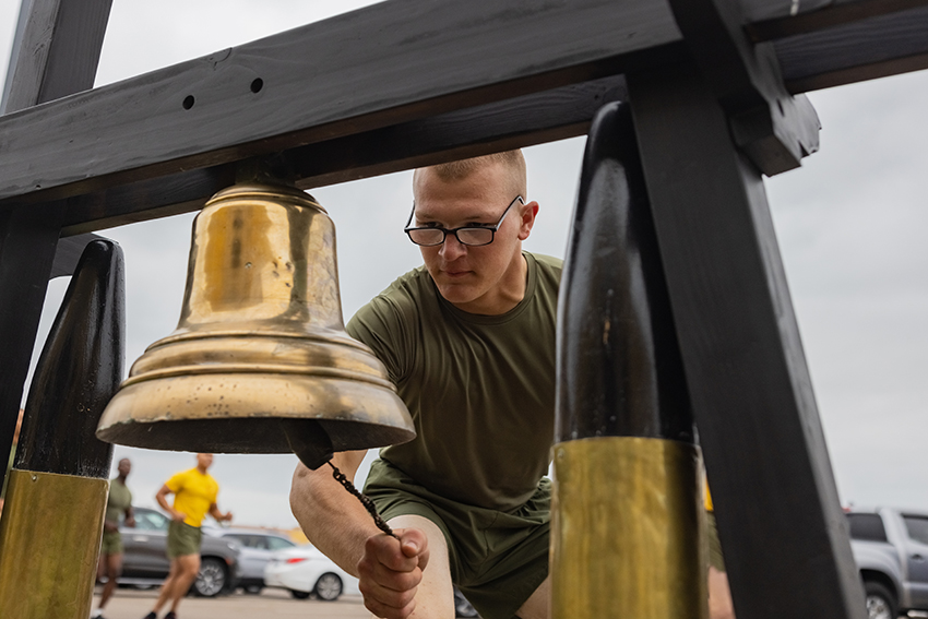 A new U.S. Marine with Echo Company rings the bell during a motivational run