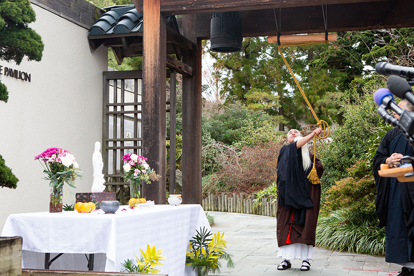 Rev. Inryū Poncé-Barger of the All Beings Zen Sangha sounds the 1798 hanshō three times at a dedication event for the bell at the U.S. National Arboretum during the 2024 National Bell Festival