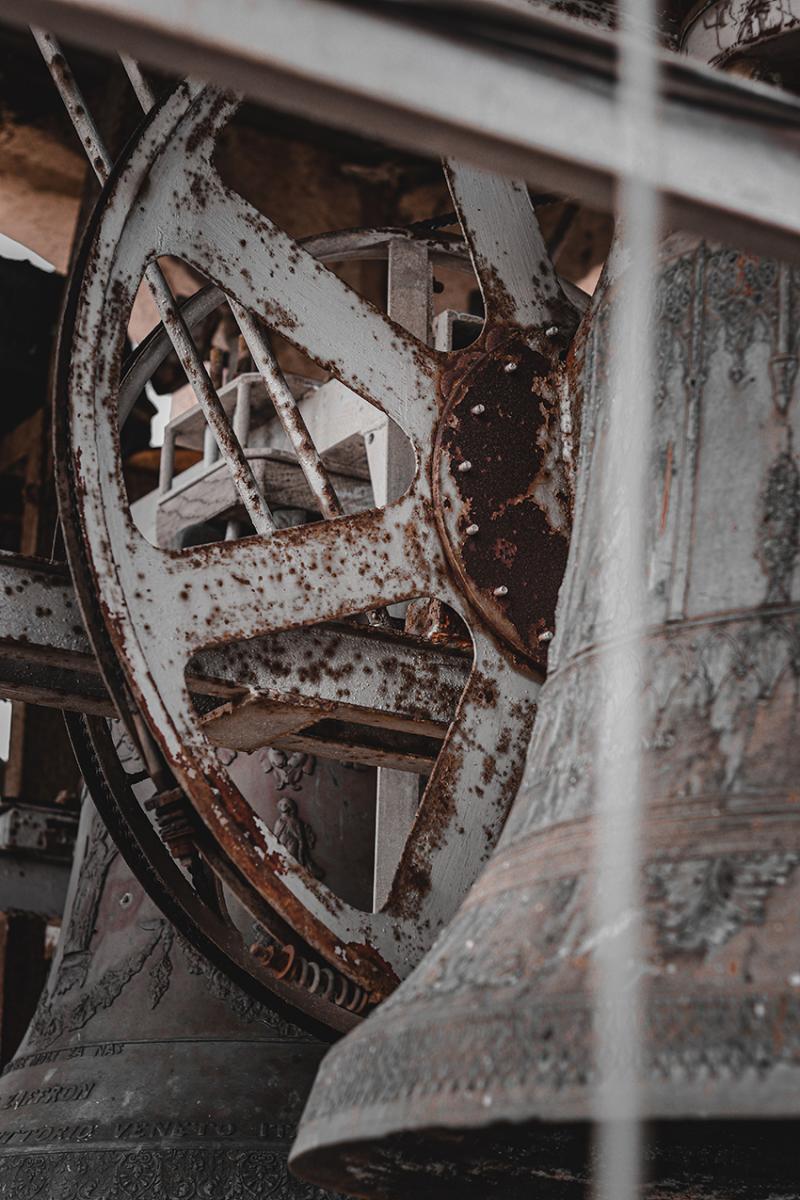 Rusted bell and tower supports are in need of a bell tower inspection and maintenance