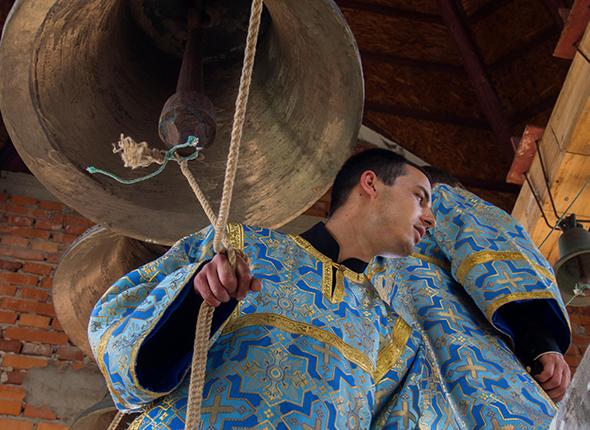 A Ukrainian Orthodox bell ringer rings for peace in Luhansk, Ukraine