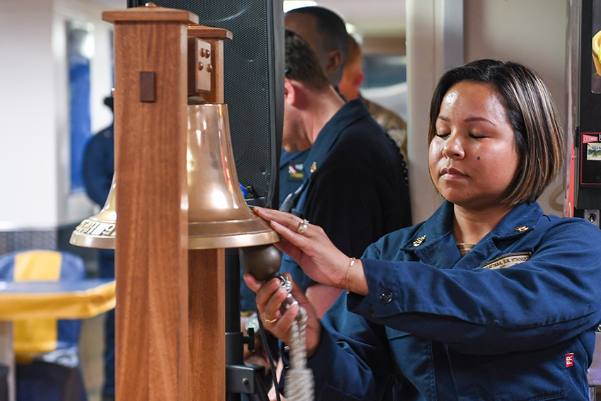 Hospital Corpsman rings a bell to celebrate U.S. Navy birthday