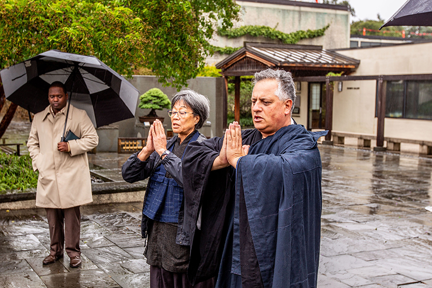 Members of the All Beings Zen Sangha offer a traditional Buddhist chant at the bell pavilion groundbreaking